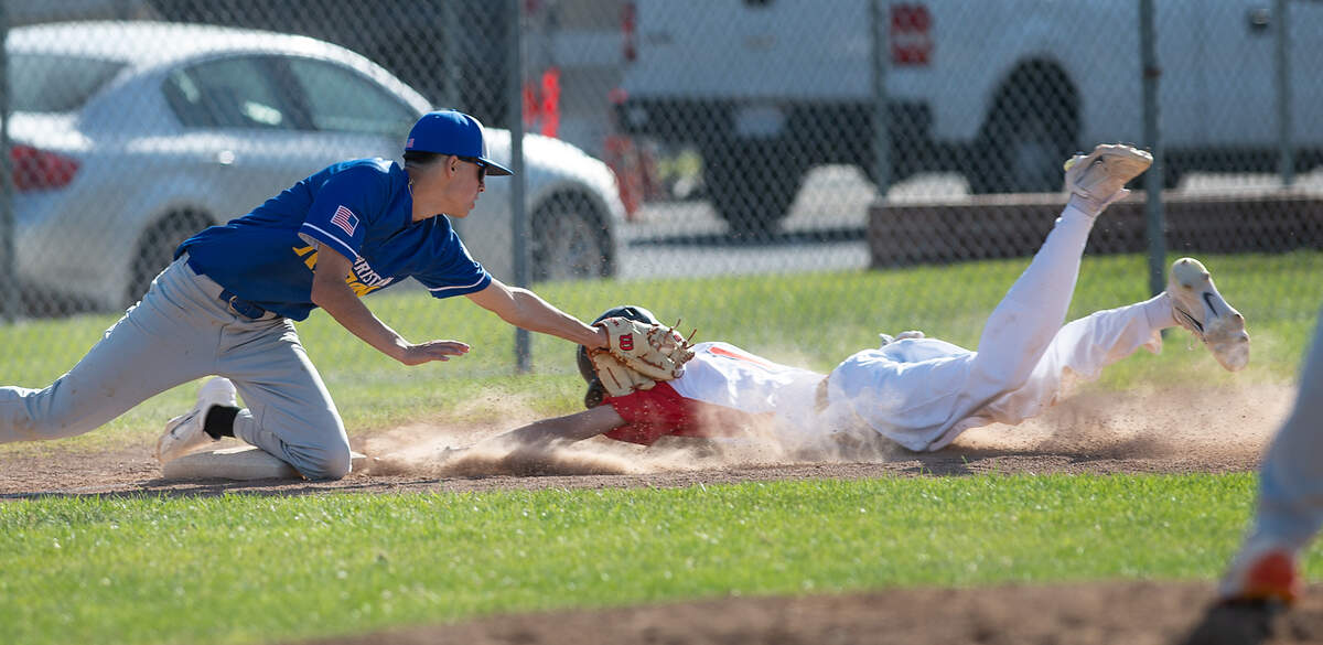 Ripon Christian third baseman Luke Crivello tags out Modesto’s Jeffrey Weber in the Windemuth Tournament championship game at Modesto High School in Modesto, Calif., Thursday, April 13, 2023. Modesto won 6-3.