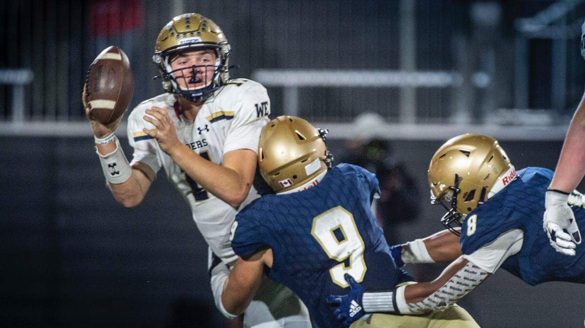 Central Catholic quarterback Tyler Wentworth (11) is taken down as he attempts a pass by Mater Dei Catholic Luke Teskey (9) during the CIF State Division II-AA Championship atSaddleback College in Mission Viejo on Friday, Dec. 10, 2021.