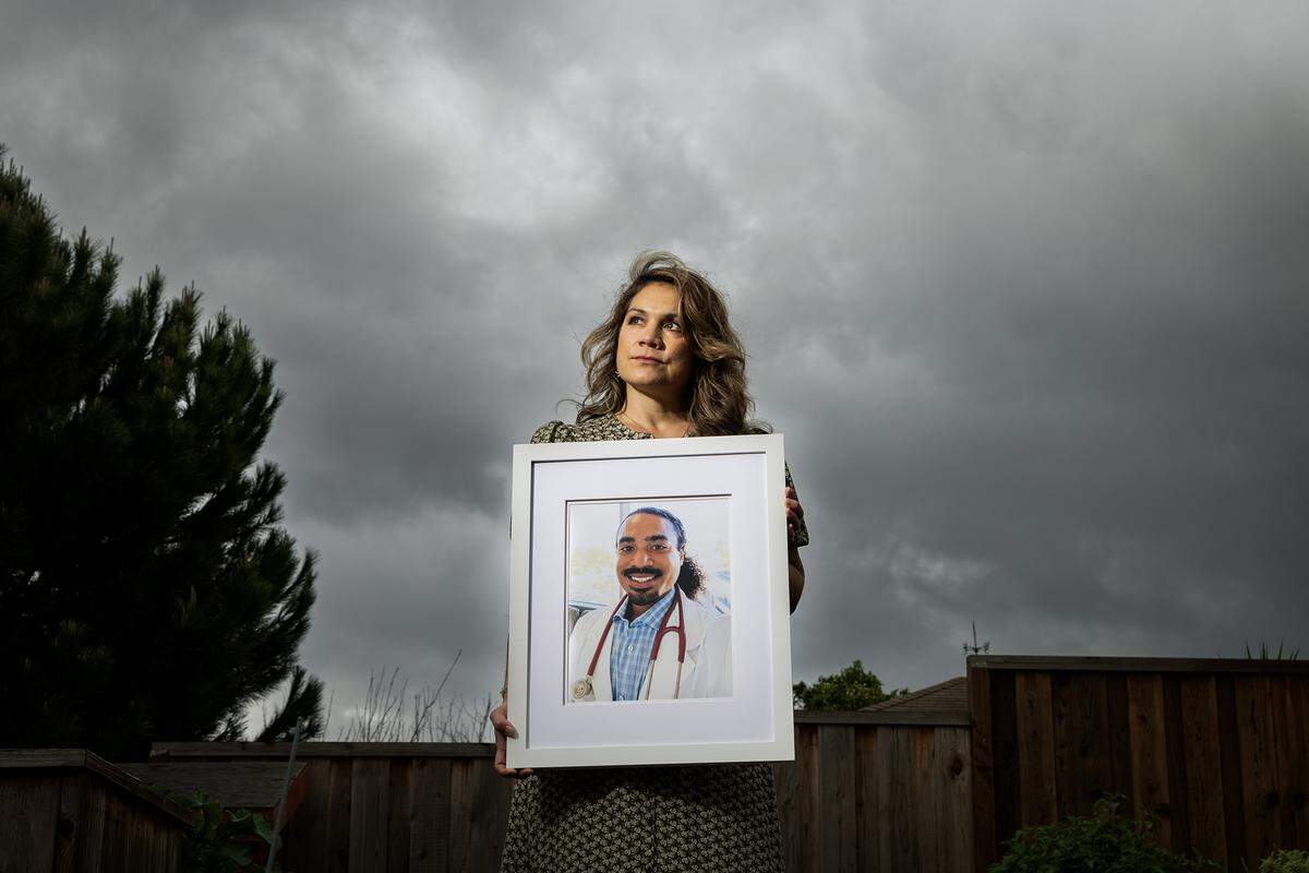 Nora Lopez holds a framed photo of her son at her home in Castro Valley on March 12, 2025. Her 29-year-old son, Dominic Lopez-Toney, was struck and killed by a semi-truck days before starting his surgical rotation at a San Joaquin hospital.
