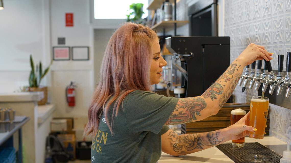 Brethren “beertender” Becca Silva pours a beer at Brethren Brewing Company Friday, June 30, 2023. All of Brethren’s beertenders go through a Cicerone Certification Program, which includes testing knowledge of how to pour a beer.