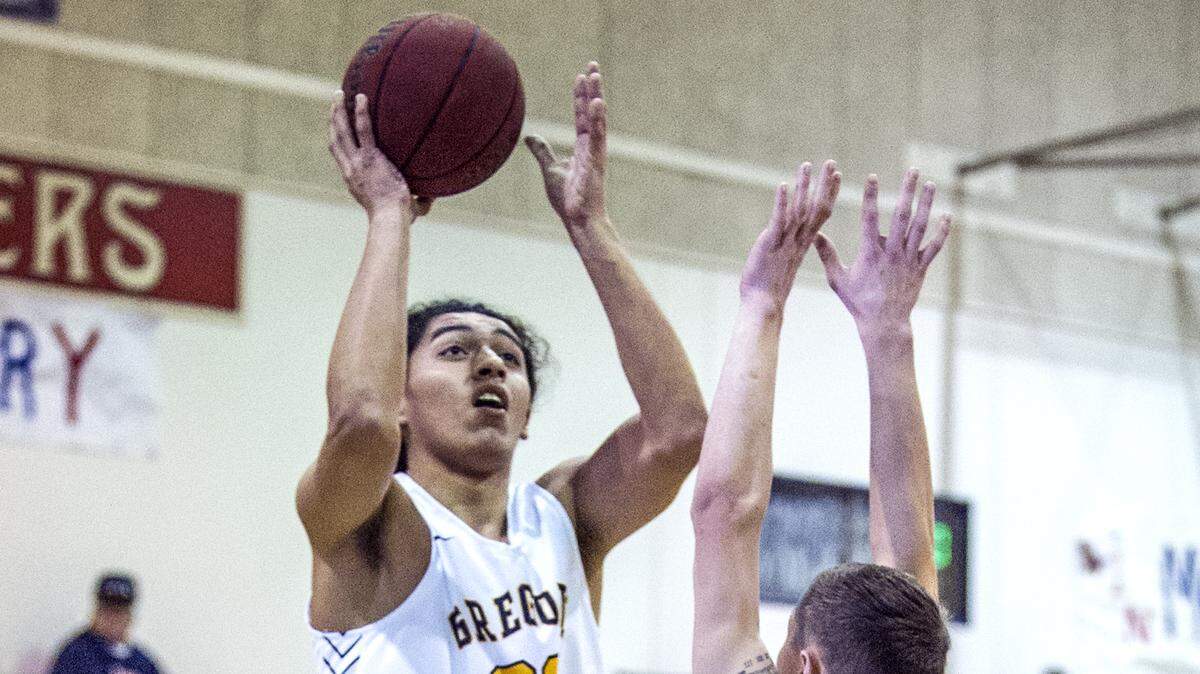 Carlos Hernandez, (20) of Gregori, takes a shot over a defender, during the basketball matchup between Gregori High of Modesto, and Liberty Ranch High of Galt, at the Modesto Christian Holiday Hoop Classic tournament, on Saturday, Dec. 28, 2019, in Modesto, California.