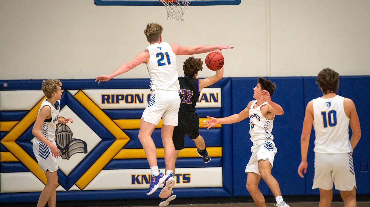 Ripon Christian’s Thys Van Der Hoek blocks Escalon’s Ben Fletcher during the Trans Valley League game at Ripon Christian High School in Ripon, Calif., on Friday, Jan. 7, 2022. Ripon Christian won the game 61-53.