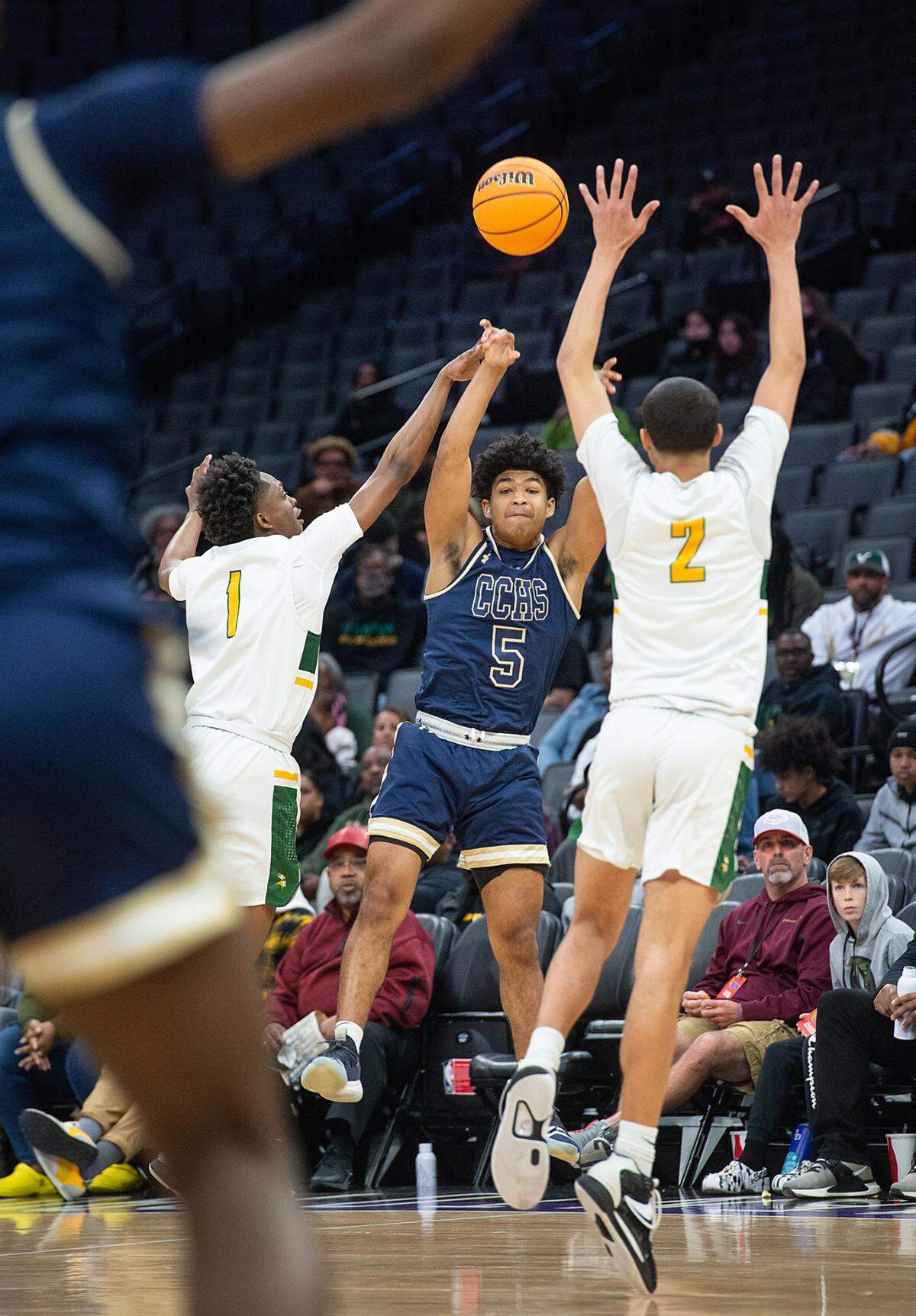 Central Catholic’s Jaelen Nichols passes the ball under pressure from Vanden defenders during the boys Sac-Joaquin Section Division 3 final at the Golden 1 Center in Sacramento, Calif., on Saturday, Feb. 26, 2022.