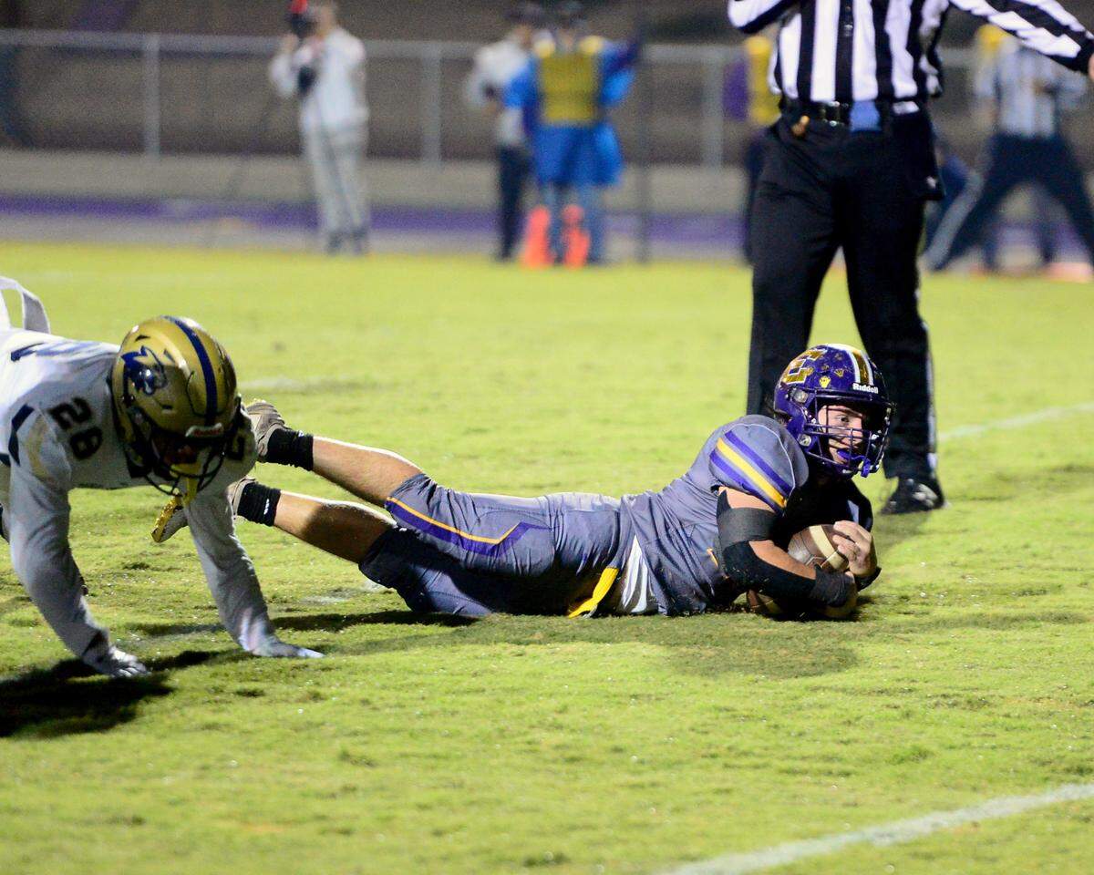 Escalon running back Josh Graham (21) dives into the end zone to score a touchdown during a 2023 CIF San Joaquin Section Division IV football game between Escalon and West Park at Escalon High School in Escalon, California, on Nov. 17, 2023. Escalon won the game 48-28.