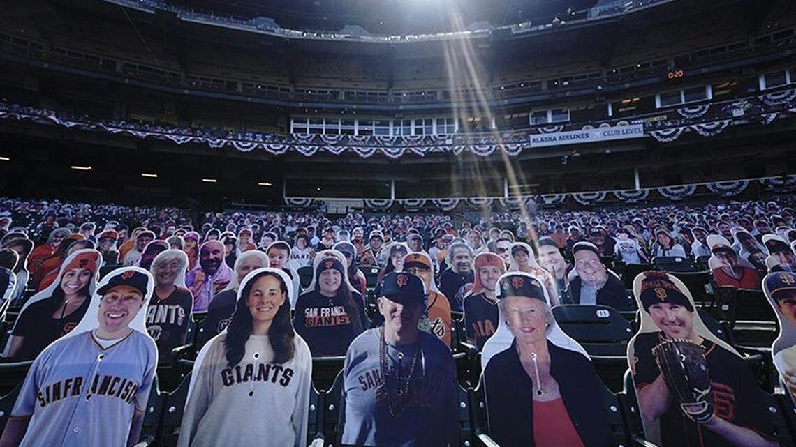 Cardboard cutouts of fans sit in seats at Oracle Park before a baseball game between the San Francisco Giants and the San Diego Padres in San Francisco, Tuesday, July 28, 2020. Fans will be asked to show proof of vaccination to attend the team’s 2021 home opener.