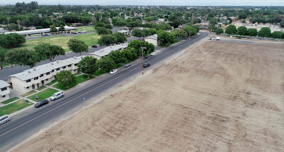 The empty lot on the south side of Robertson Road is a proposed site for Housing Authority apartment complex in Modesto in Modesto, Calif., on Saturday, June 4, 2022.