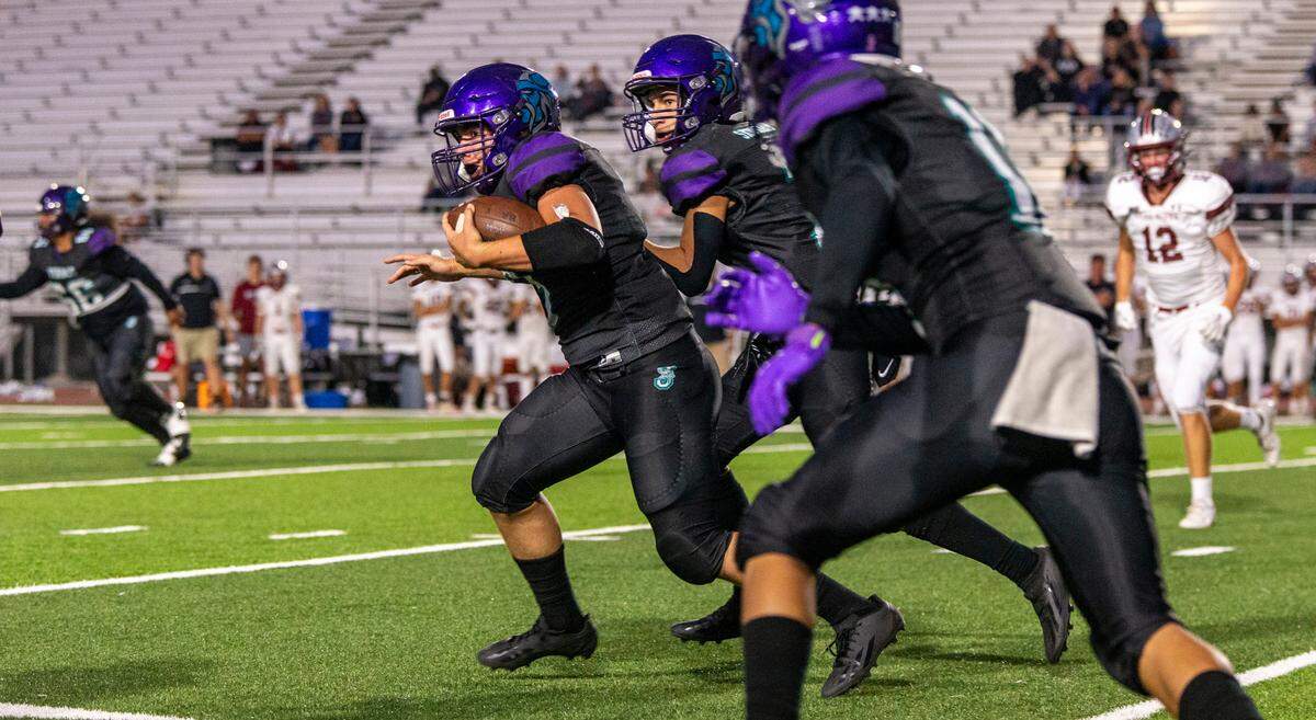 Seth Bierman, 3, of Johansen works his way upfield during the non-league game with Bear River at Johansen High School in Modesto Calif., Friday, Sept. 1, 2023.