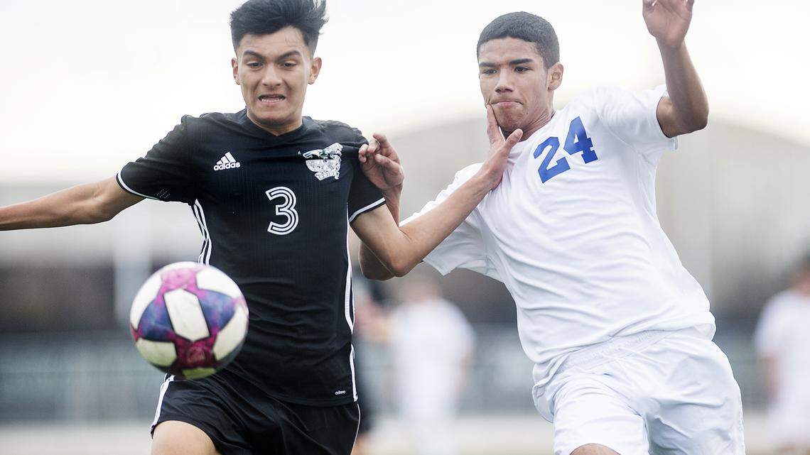 Pitman’s Jaison Zuinga (3) and Turlock’s Alex Ayala (24) chase down the ball during the Central California Athletic League game at Pitman High School in Turlock, Calif., on Wednesday, Jan. 22, 2020.