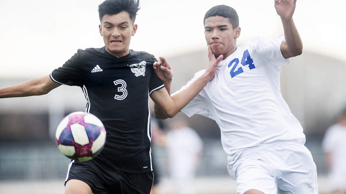 Pitman’s Jaison Zuinga (3) and Turlock’s Alex Ayala (24) chase down the ball during the Central California Athletic League game at Pitman High School in Turlock, Calif., on Wednesday, Jan. 22, 2020.