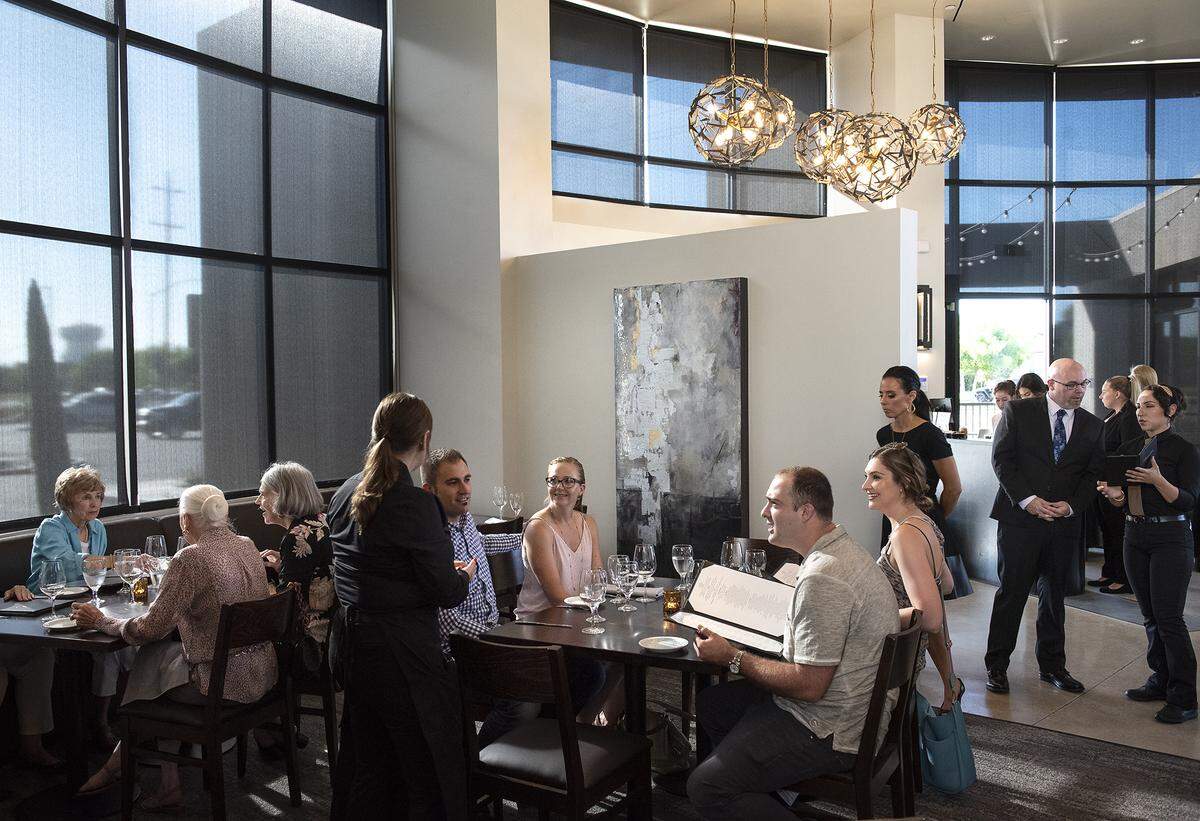 Guests enjoy dinner during preview night at the Fina restaurant in Ripon on Aug. 2, 2019.