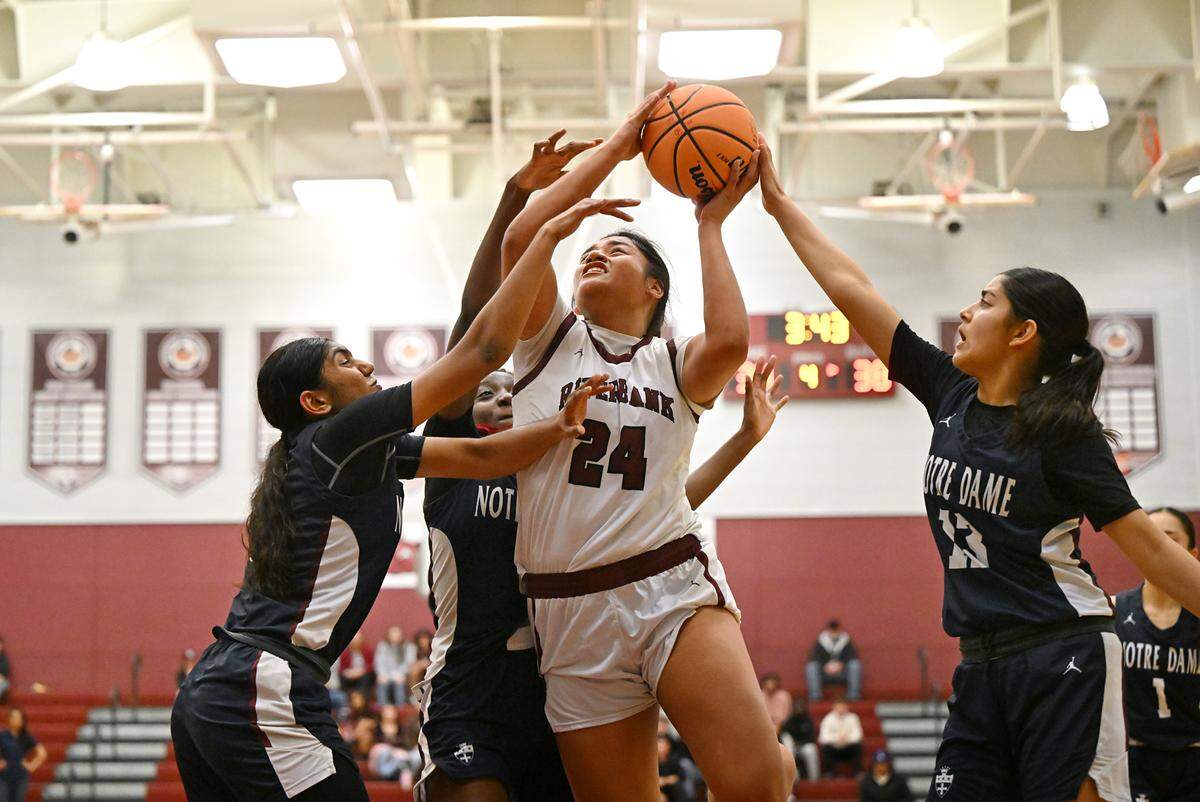 Riverbank’s Rayne Tago attacks the basket and draws a foul during the CIF Northern California Division IV playoff game with Notre Dame at Riverbank High School in Riverbank, Calif., Thursday, Feb. 29, 2024. Riverbank lost in overtime 47-46.