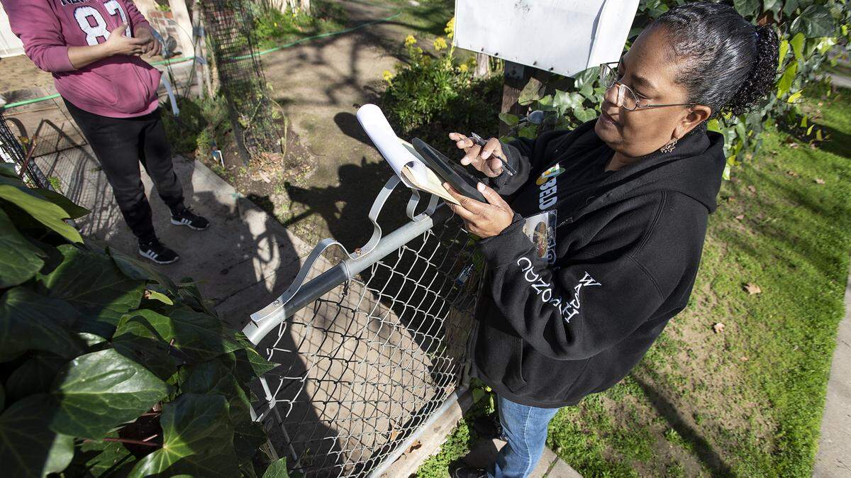 Faith in the Valley’s Liz Wortham talks with a resident of west Modesto as she canvasses the neighborhood to get the word out about the 2020 Census in Modesto, Calif., on Wednesday, Jan. 29, 2020.
