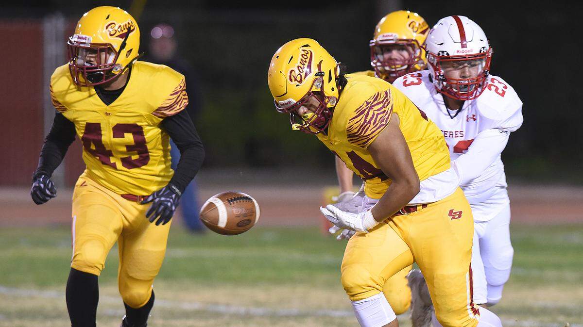 Ceres High cornerback, Delgado Aaron, right, knock the ball loose from the hands of Los Banos runner, Tomas Lagos in the third quarter Fri., Oct. 18, 2019 at Loftin Stadium in Los Banos. Los Banos retained possesion of the ball and went on to win the game 56-14.