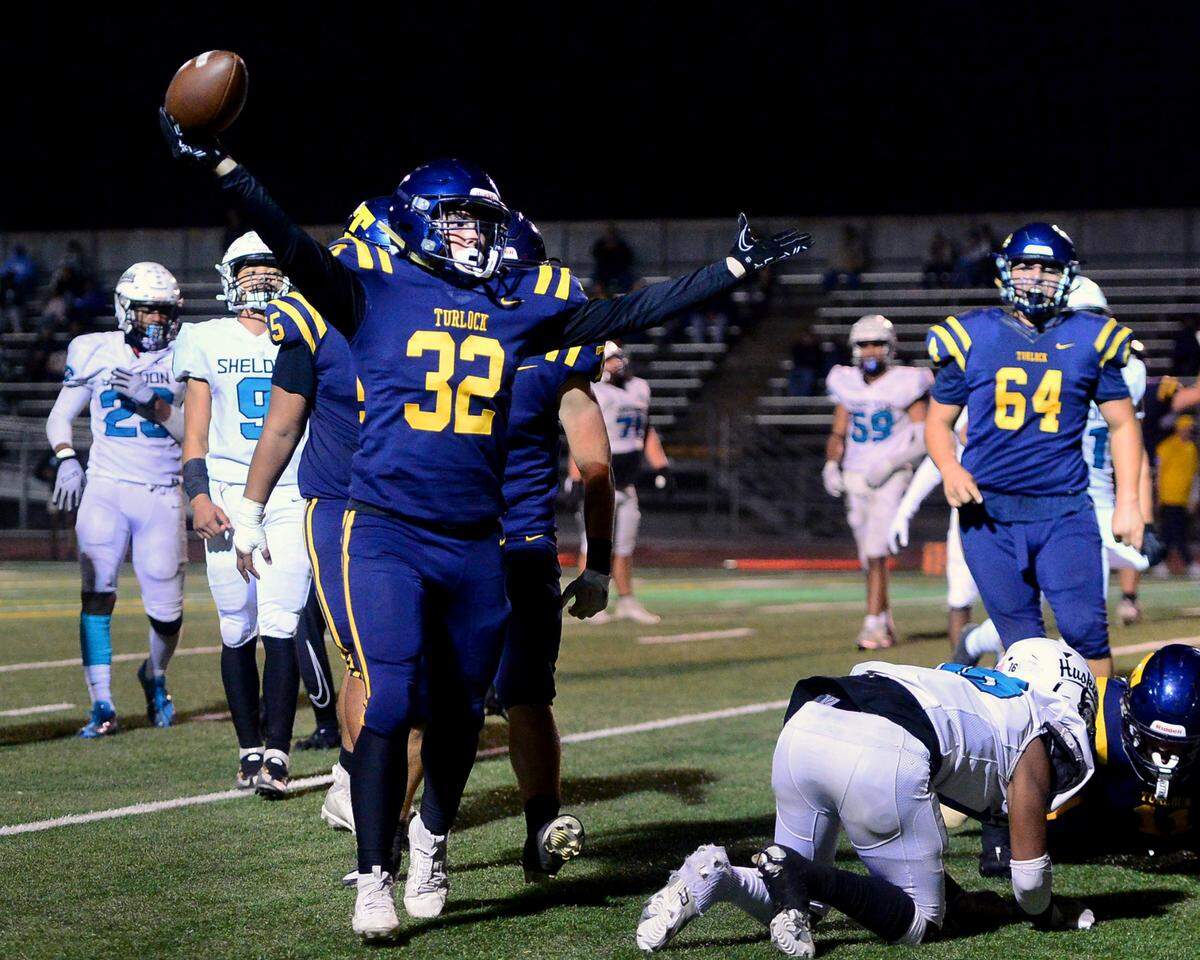 Turlock running back Kaleb Guinn (32) celebrates after scoring a touchdown during a CIF Sac-Joaquin Section Football Division I playoff game between Turlock High School and Sheldon High School at Turlock High School in Turlock, California on Nov. 3, 2023.