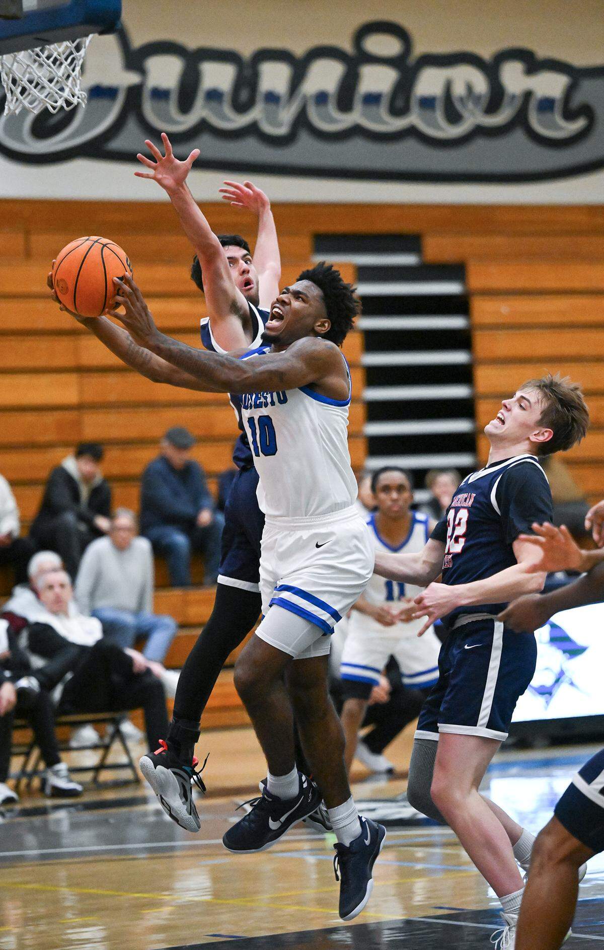 Modesto’s Malachi Miller slips ARC defenders during the Big 8 Conference game with American River College at Modesto Junior College in Modesto, Thursday, Feb. 13, 2025. Modesto won the game 115-78.