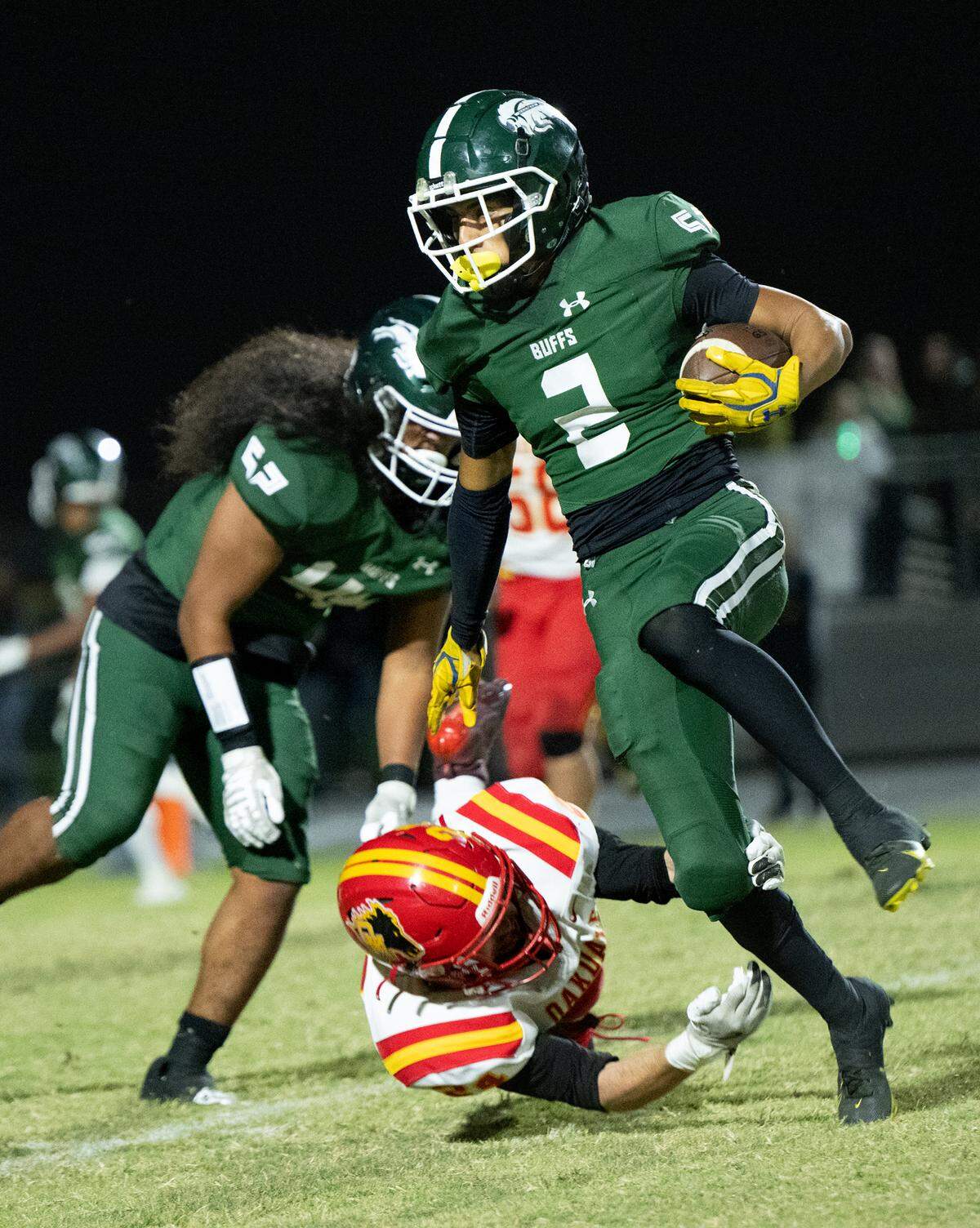 Manteca’s Quinn Martinez (2) runs the ball during the Valley Oak League game with Oakdale at Manteca High School in Manteca, Friday, Nov. 1, 2024.