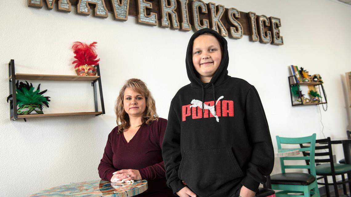 Dylan McDonald with his mother Deborah McDonald at the family shaved ice store in Oakdale, Calif., on Monday, Dec. 27, 2021. Dylan was bullied by several boys and has since received support from the Oakdale community.