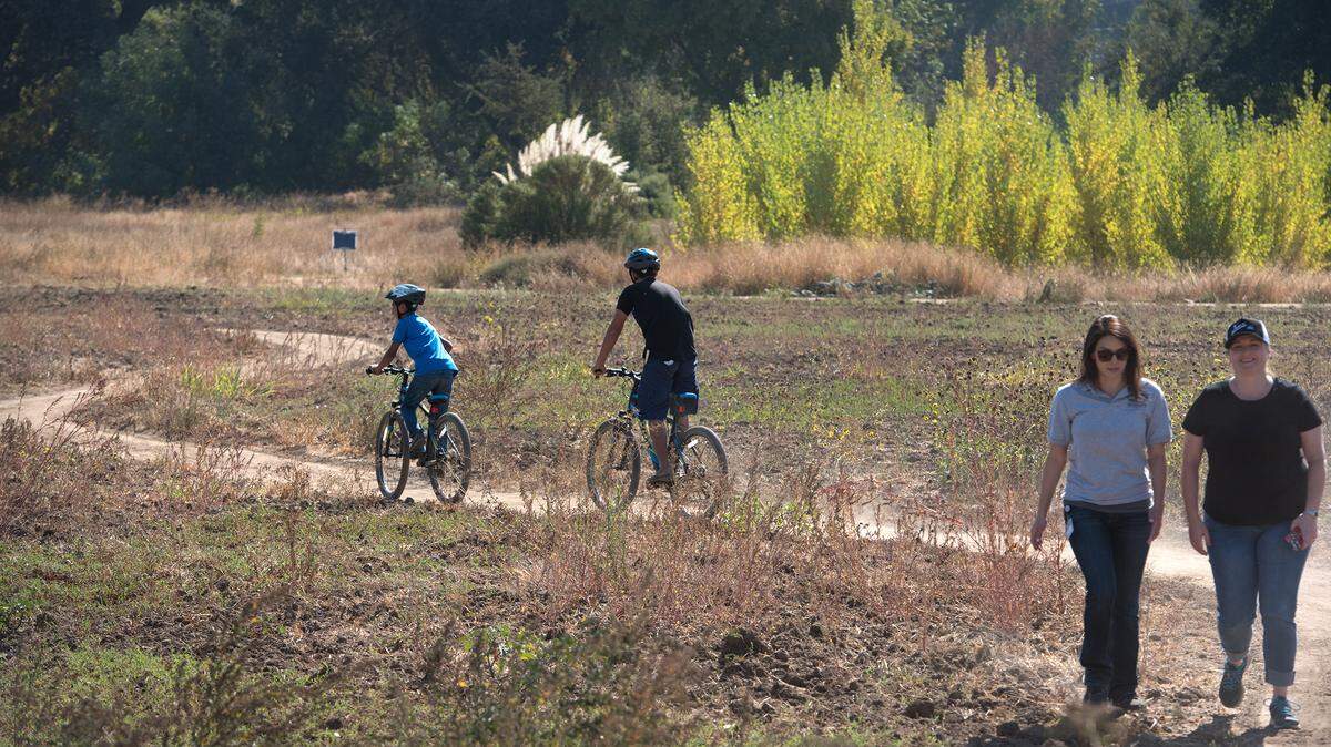 Bicylclists and walkers enjoy the trails in the Gateway parcel during RecFest at Tuolumne Regional Park in Modesto, Ca., on Saturday, Oct. 20, 2018.