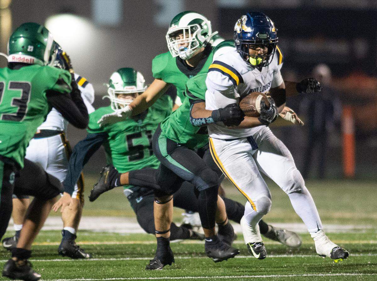 Turlock’s J.T. Foreman II runs the ball during the CIF Sac-Joaquin Section Division 1 playoff game with St. Mary’s at St. Mary’s High School in Stockton, Calif., Friday, Nov.11, 2022.