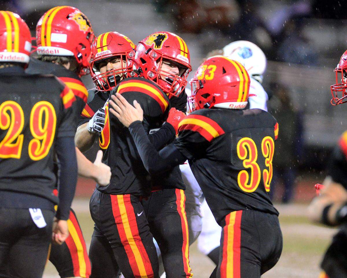 Oakdales Dylan Krause (center) celebrates with teammates after recovering an onside kick in the fourth quarter during a 2024 CIF Sac-Joaquin Section Division 3 playoff game between Oakdale High School and Destiny Christian Academy at Oakdale High School in Oakdale California on November 22, 2024. Oakdale won the game 49-35.