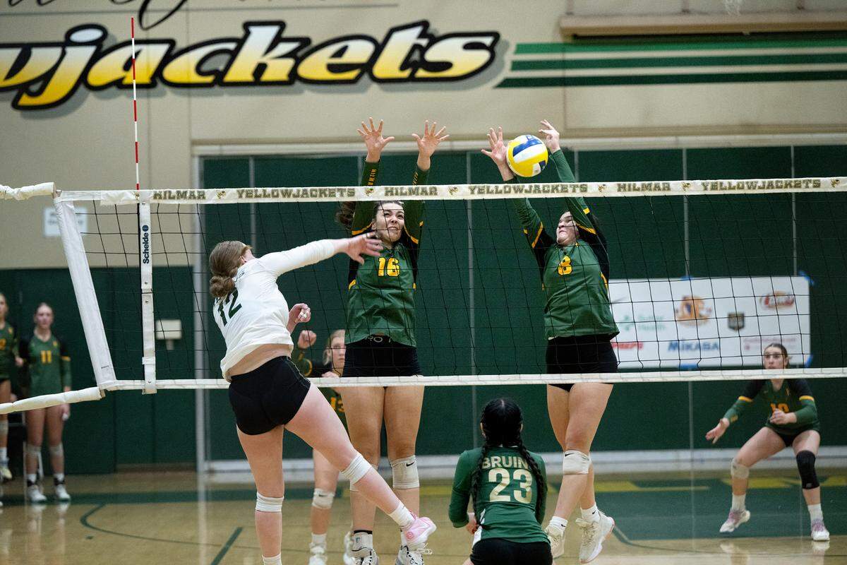 Hilmar’s Emma Gomes (8) blocks the shot from St. Patrick-St.-Vincent’s Cierra Ray during the CIF Northern California Division IV volleyball championship at Hilmar High School in Hilmar, Tuesday, Nov. 19, 2024.