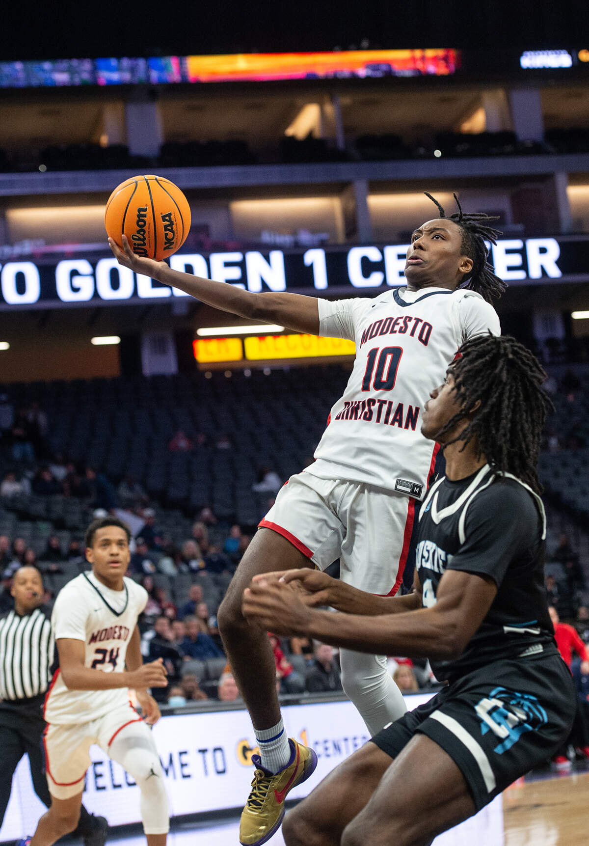 Modesto Christian’s Bj Davis scores a basket during the Sac-Joaquin Section Division 1 boys basketball championship game with Sheldon at the Golden 1 Center in Sacramento, Calif., on Saturday, Feb. 26, 2022. Modesto Christian won the game 52-42.