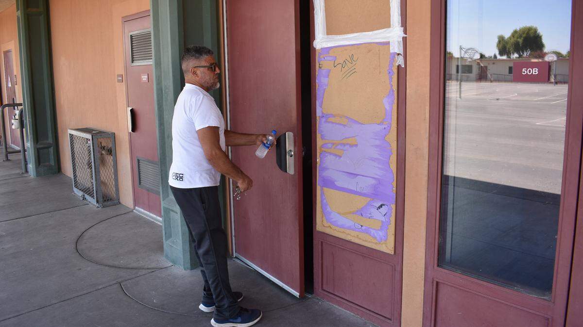 Custodian Jose Jimenez enters one of the two burglarized classrooms at Crossroads Elementary School on Saxon Way in Riverbank on Tuesday morning, July 9, 2019.