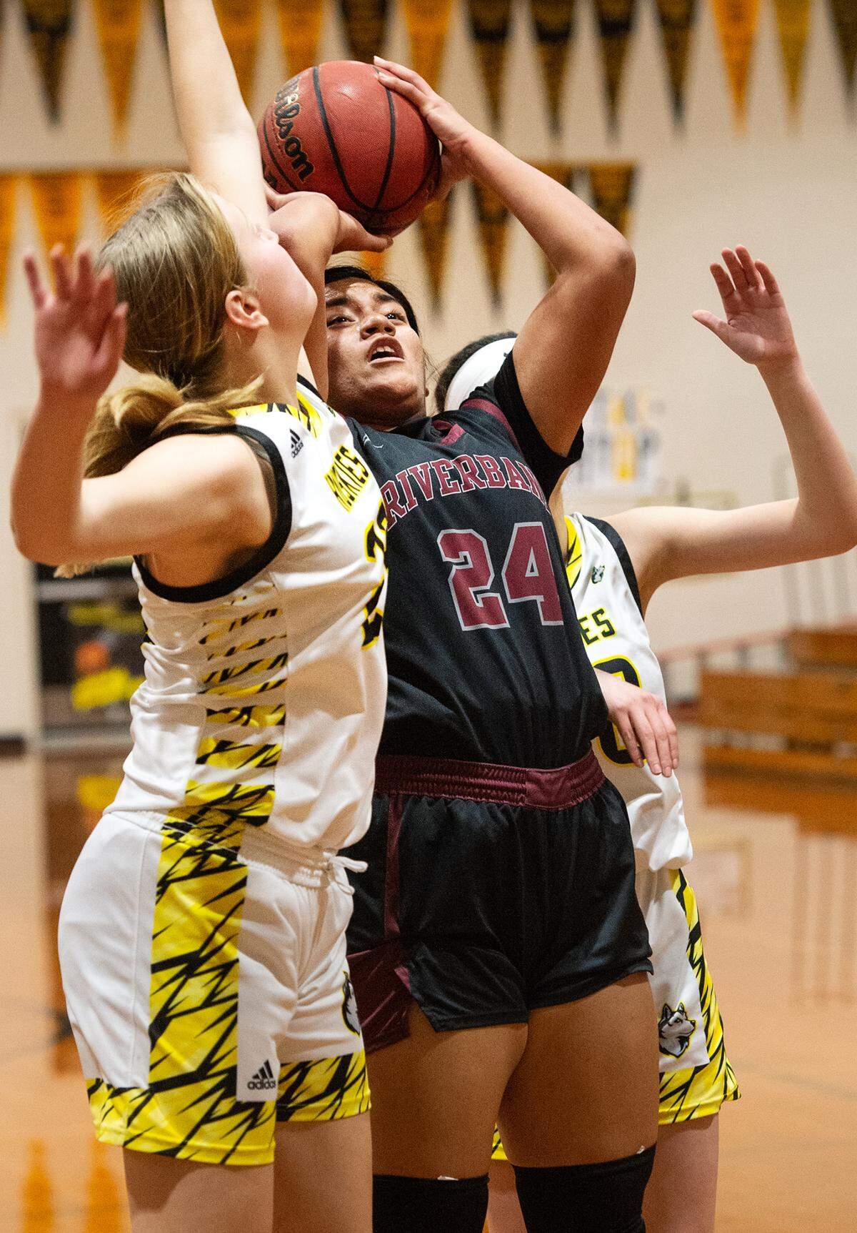 Riverbank’s Rayne Tago shoots over Hughson’s Gracie Quillen during the Trans Valley League game in Hughson, Calif., Tuesday, Jan. 31, 2023.