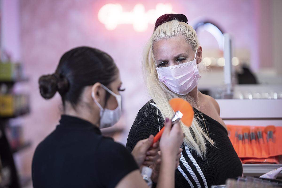 Lisa Ballew, right, shops at Glamify Me at Vintage Faire Mall in Modesto, Calif., on Saturday, May 23, 2020. The mall and some stores have reopened after being closed due to the coronavirus shutdown.