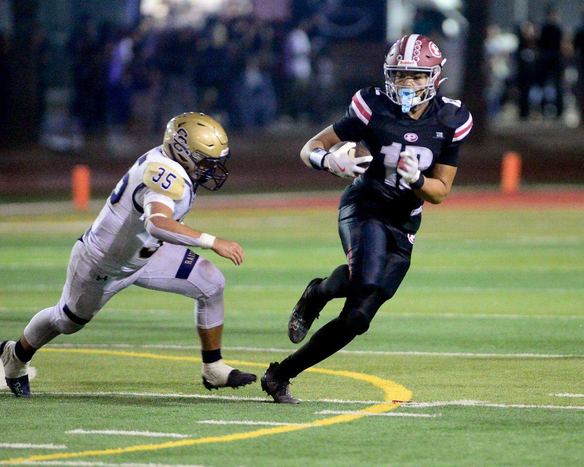 Patterson tight end Jace Johnson (12) sprints away from a defender during a game between Central Catholic High School and Patterson High School at Patterson High  on Sept. 9, 2024. Central Catholic won the game 25-14.