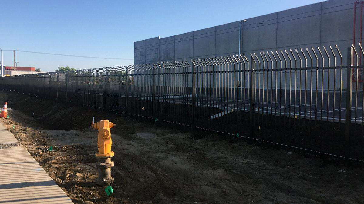 The city hydrant that G3 Enterprises claims failed last month and caused extensive damage to one of their construction projects is pictured June 28, 2018. The hydrant is next to a new G3 Enterprises warehouse. 