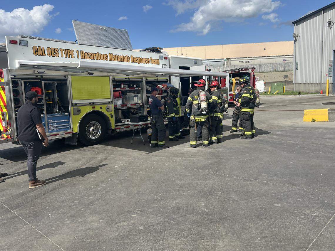 A hazmat team from the Modesto Fire Department respond to an explosion that injured two sanitation workers in Riverbank, CA on March 27, 2025.