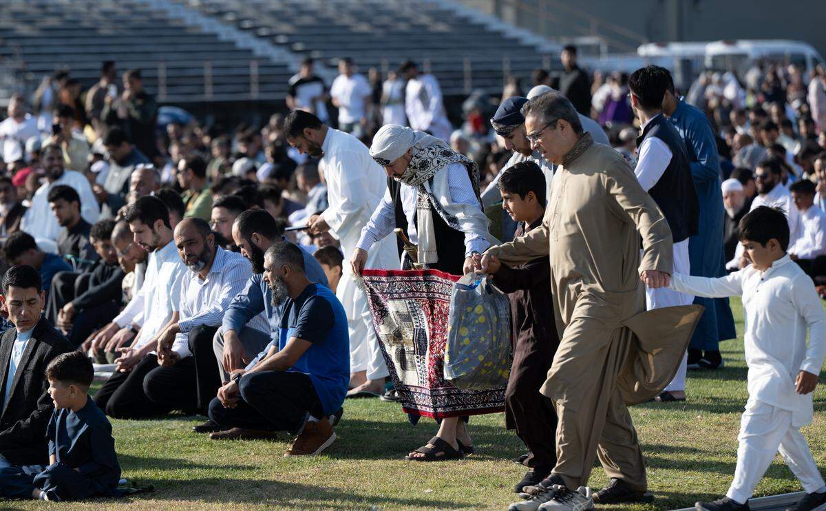 Muslim community members participate in an Eid prayer at Modesto Junior College in Modesto, Friday, June 6, 2025.