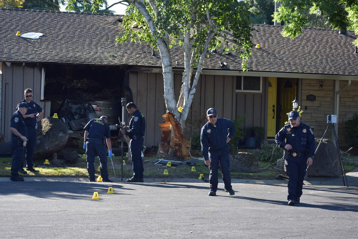 Members of the CHP’s major accident investigation team from Fresno work the scene of a crash into a home in Modesto’s Sherwood Forest neighborhood that killed one person early Tuesday, June 9, 2026. The house is on Tuxford Lane at the corner where it becomes Robin Hood Drive.