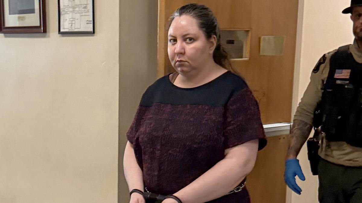 Mina Nazari, 36, is escorted out of a Stanislaus County courtroom after a jury found her legally sane in the killing of her 4-year-old daughter and the attempted murder of her son.