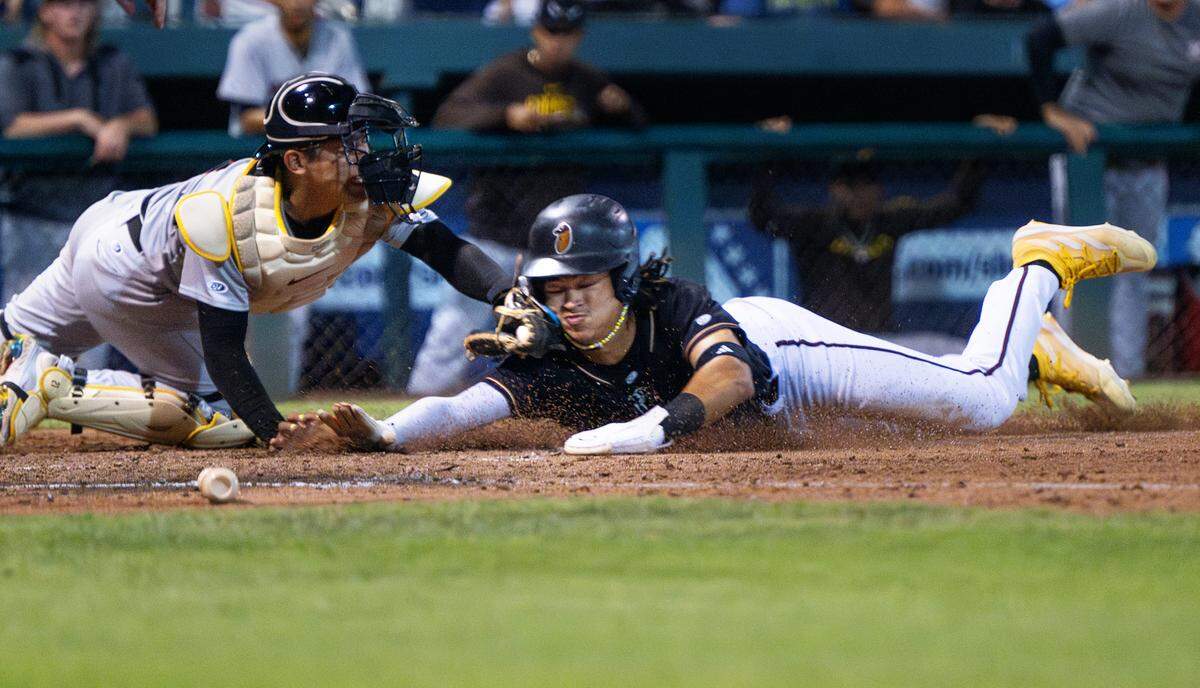 Modesto’s Tai Peete is tagged out at home plate during the California League Championship game with Lake Elsinore at John Thurman Field in Modesto, Calif., Wednesday, Sept. 18, 2024.