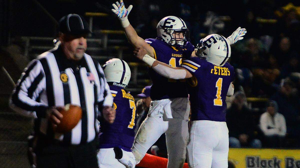 Escalon receiver Owen Nash (13) celebrates a touchdown with teammate Ryker Peters (1) during the 2022 CIF NorCal Division 4-AA Bowl Game between Escalon High School and Pleasant Valley High School at Escalon High School in Escalon CA on Dec. 2, 2022. Escalon won the game 42-20.