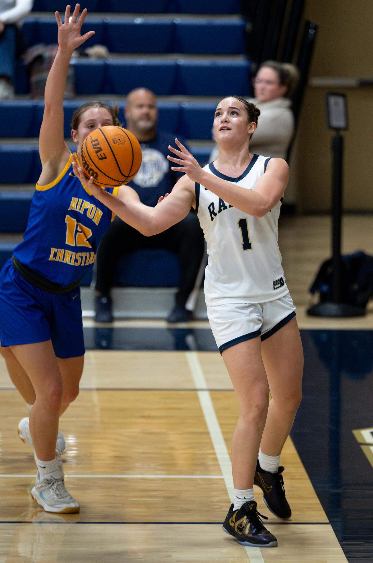 Central Catholic’s Ayla Parcon attempts a layup past Ripon Christian’s Annika Jung during the MST Gallo Tournament at Central Catholic High School in Modesto, Monday, Dec. 29, 2025.