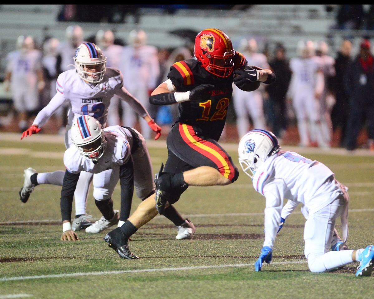 Oakdale running back Wes Burford (12) makes a cut up field during a 2024 CIF Sac-Joaquin Section Division 3 playoff game between Oakdale High School and Destiny Christian Academy at Oakdale High School in Oakdale California on November 22, 2024. Oakdale won the game 49-35.