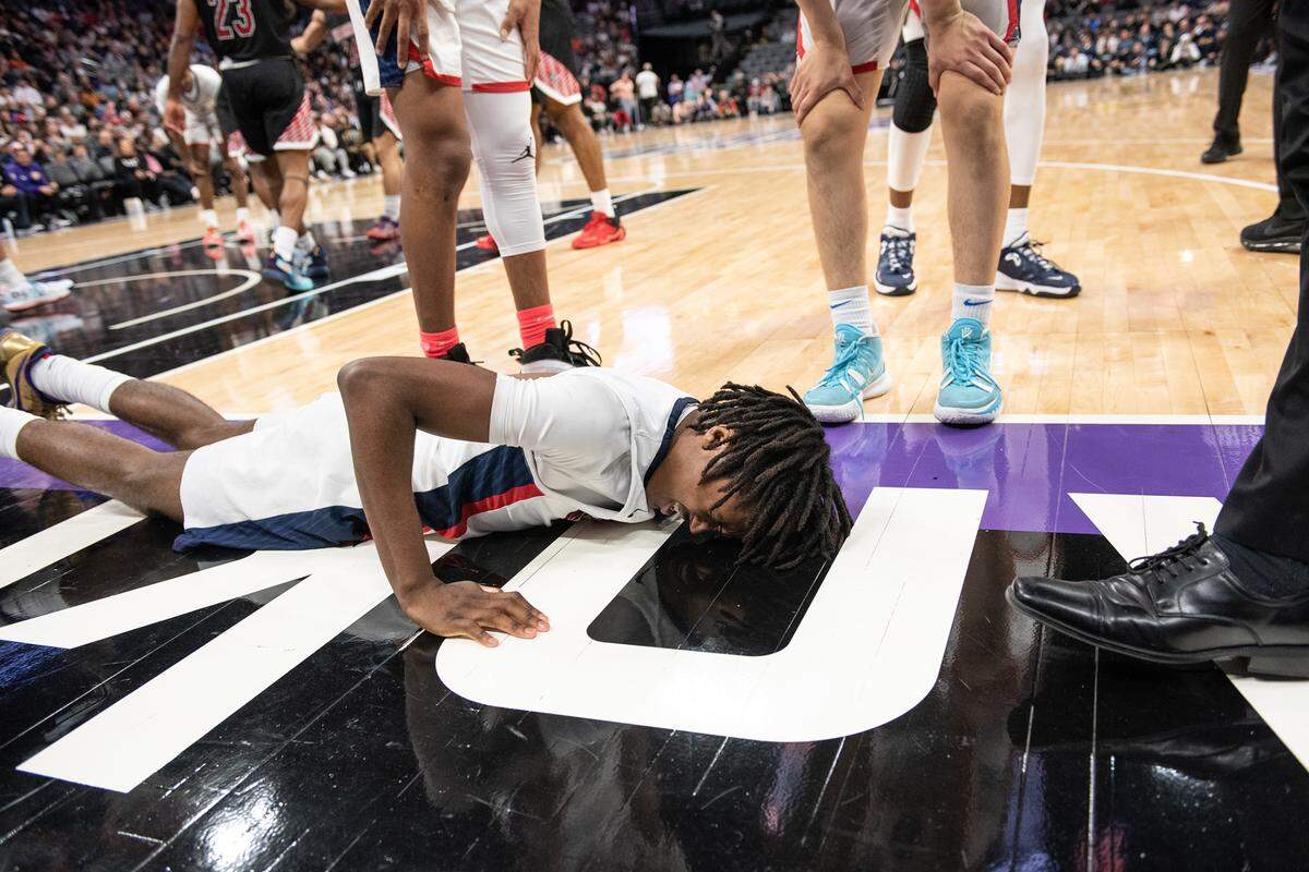 Modesto Christian’s BJ Davis gets up slowly after hitting the court on a layup during the boys Open Division CIF State Basketball Championship game with Centennial at Golden 1 Center in Sacramento, Calif., on Saturday, March 12, 2022. Centennial won the game 59-50.