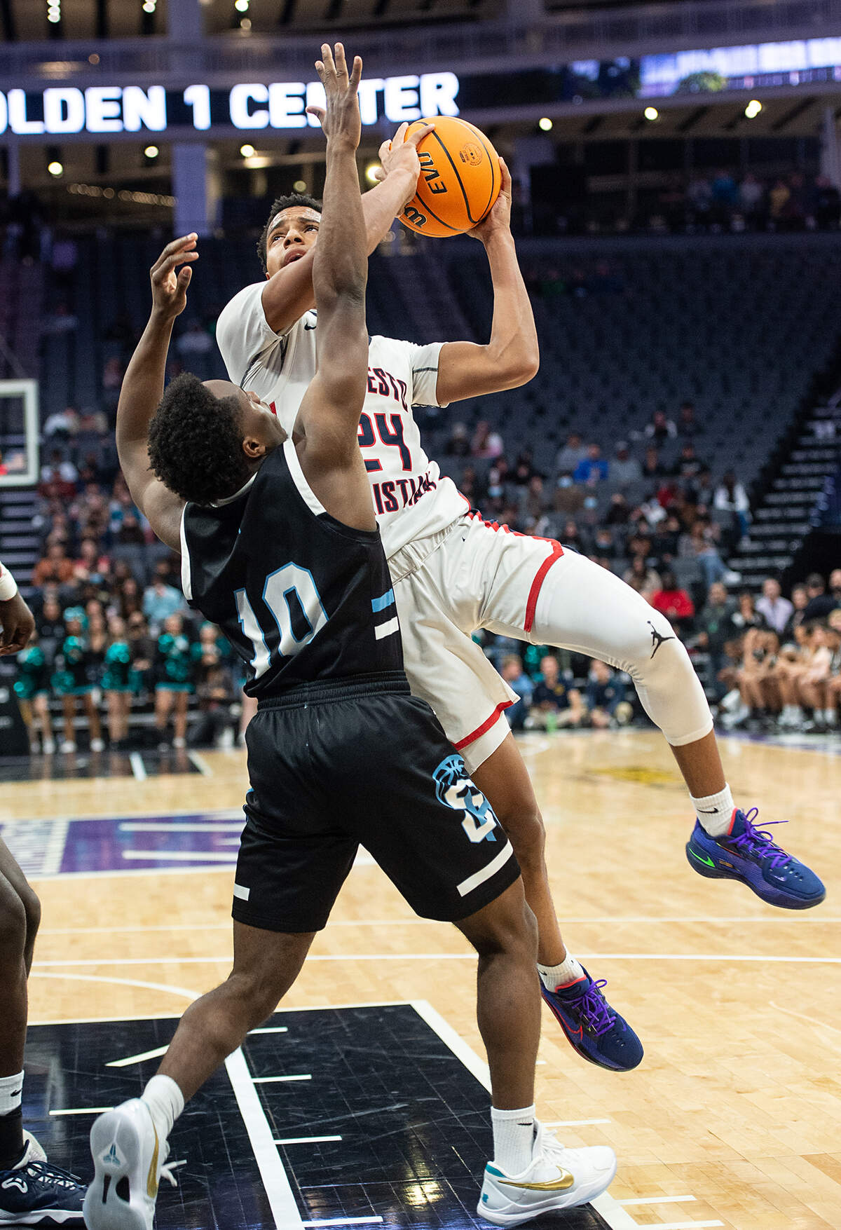 Modesto Christian’s Jamari Phillips challenges Sheldon’s Josiah Johnson during the Sac-Joaquin Section Division 1 boys basketball championship game at the Golden 1 Center in Sacramento, Calif., on Saturday, Feb. 26, 2022. Modesto Christian won the game 52-42.