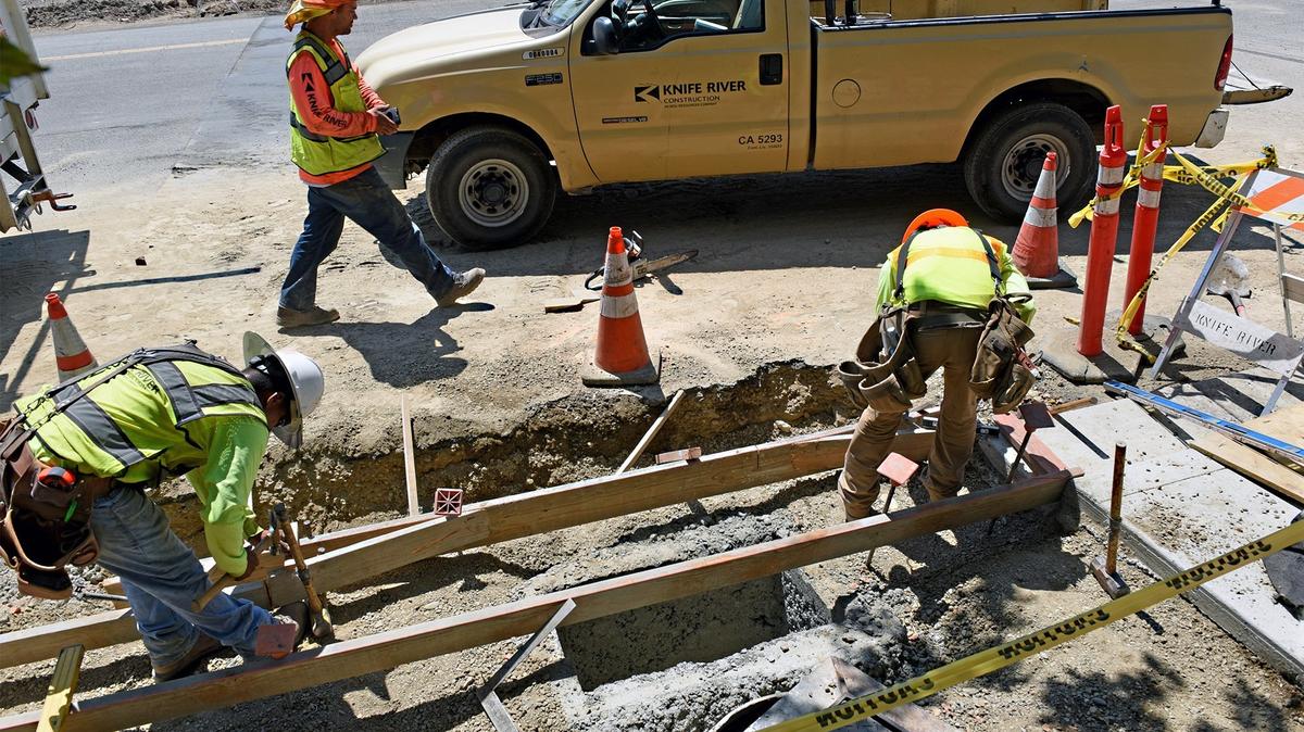 FILE PHOTO - Construction crews with Knife River work on a sidewalk on Chicago avenue at Carpenter road in Modesto, Calif. on Thursday afternoon August 16, 2018. The Carpenter road  project is one of the road improvements in Modesto funded by sales tax revenue from voter-approved Measure L.
