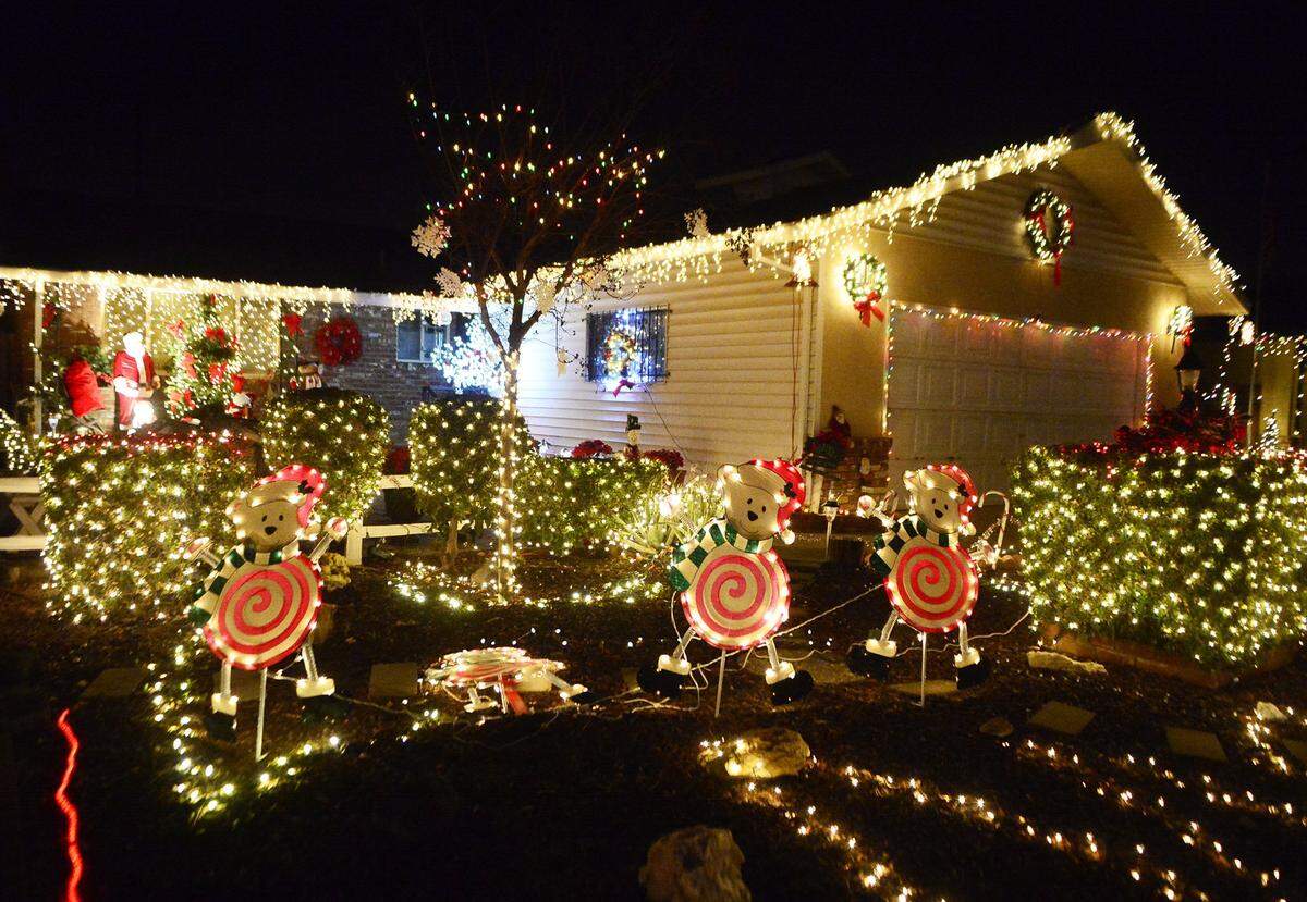 A home is decorated with a festive display of lights at Christmas Tree Lane in Ceres.