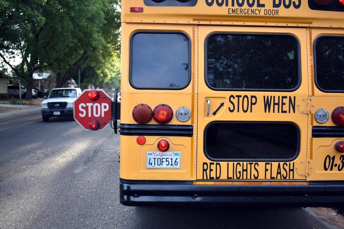 A car stops for the school bus in front of the Keane home on Glenwood Drive the morning of Tuesday, (09-12-17).