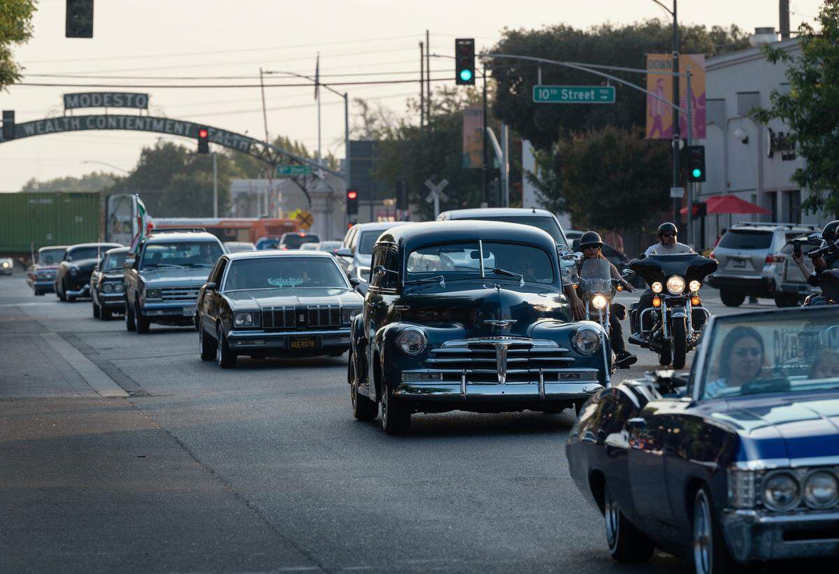 Members of car clubs cruise down I Street during the Dia de Indepedencia Cruise in Modesto, Calif., on Friday, September 9, 2022.