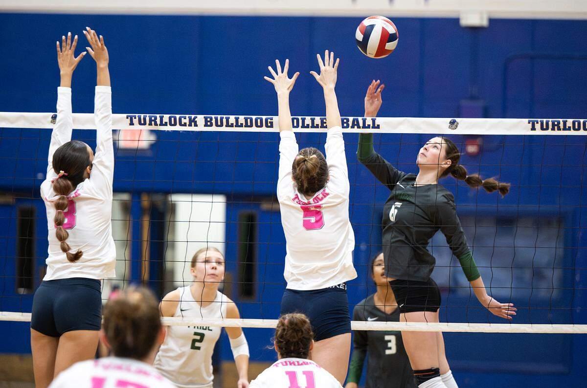 Pitman’s Maryn Hall floats the ball over Turlock defender Hailey Stiles (5) in the Central California Athletic League match at Turlock High School in Turlock, Calif., Tuesday Oct. 8, 2024.