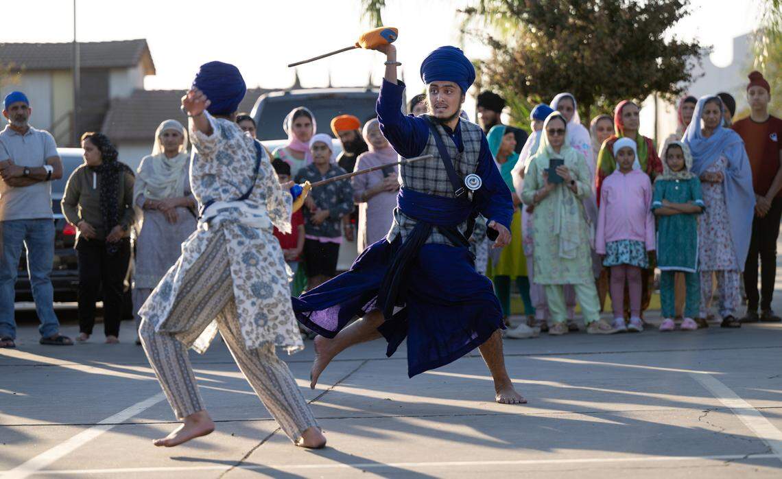 Members of the Gurdwara Sikh Temple Harkeerat Gill, right, and Pavitar Kaur perform Gatka, a Sikh martial art, at the temple in Ceres, Thursday, Oct. 24, 2024.