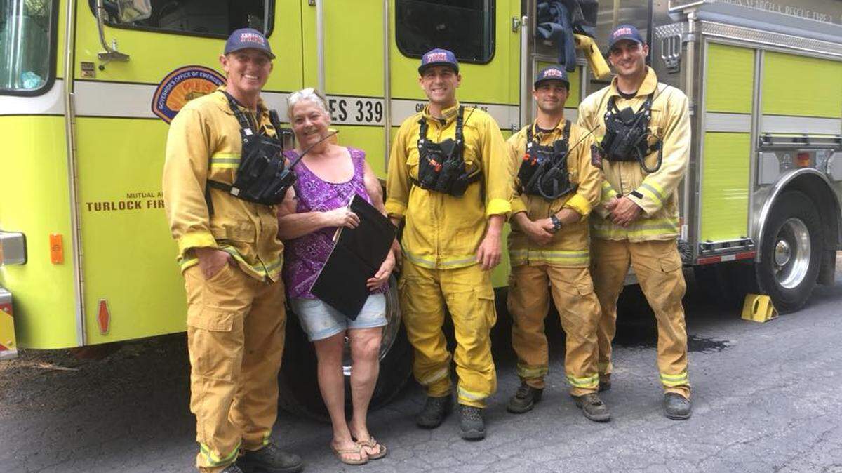From left, Capt. Shaun Walker, Brenda Marks White, firefighters Corey Thibault and Steven Kramer and engineer Cameron Kaiser.