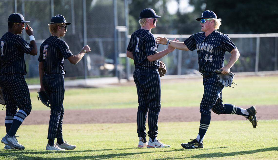 Central Catholic’s Braxton Thomas (44), right, comes off the field at the end of the Northern California Regional Division III semifinal playoff game with Arcata at Central Catholic High School in Modesto, Calif., Thursday, June 1, 2023.