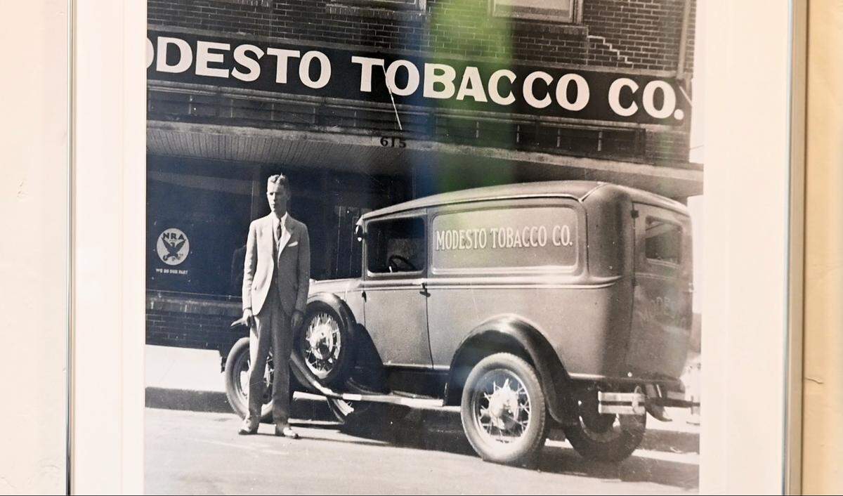 A photo of William Eakin, son of Modesto Tobacco Company founder Herbert Eakin, on the conference room wall at MTC Distributing in Modesto, Calif., Tuesday, Oct. 25, 2022.